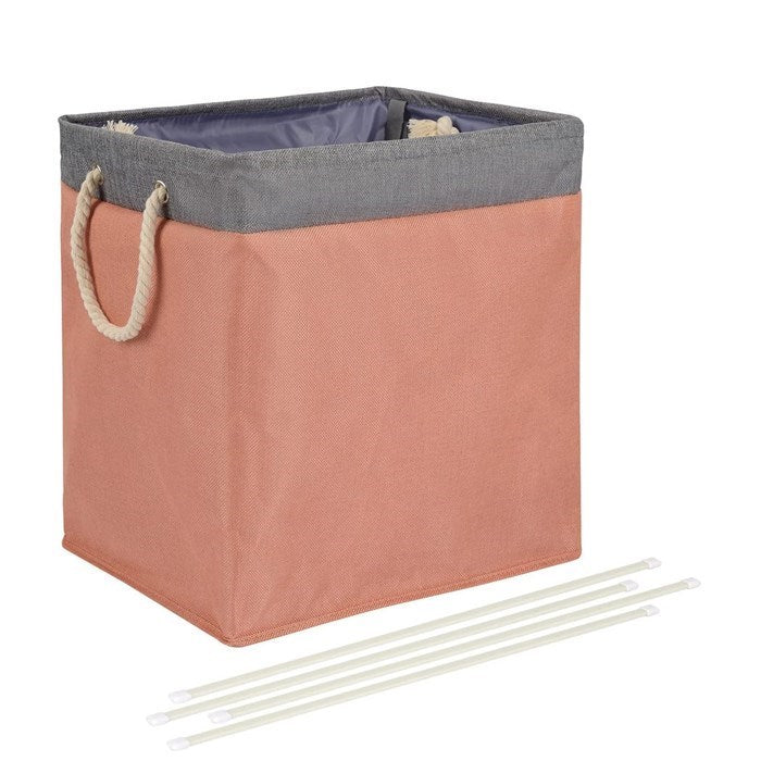 Rectangular storage basket with a gray top and pinkish-brown body, accompanied by white sticks on a white background.