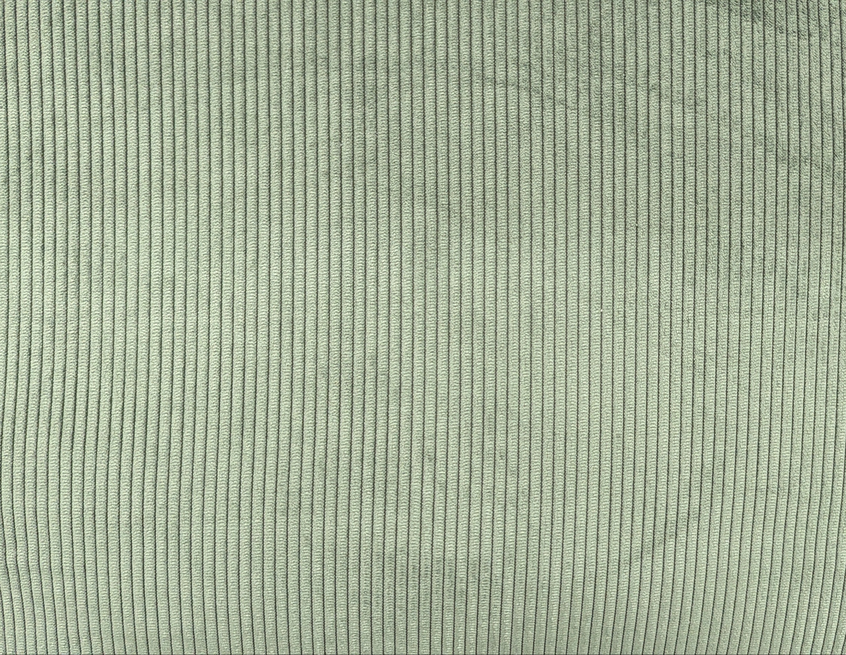 Close-up of a textured green fabric surface
